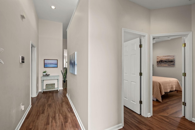 hallway with dark wood-type flooring