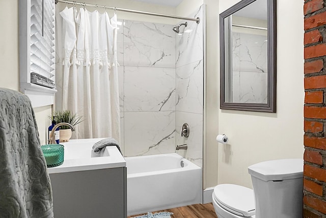 full bath with wood finished floors, toilet, shower / bath combo, and vanity
