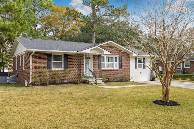 ranch-style house with central AC unit and a front lawn