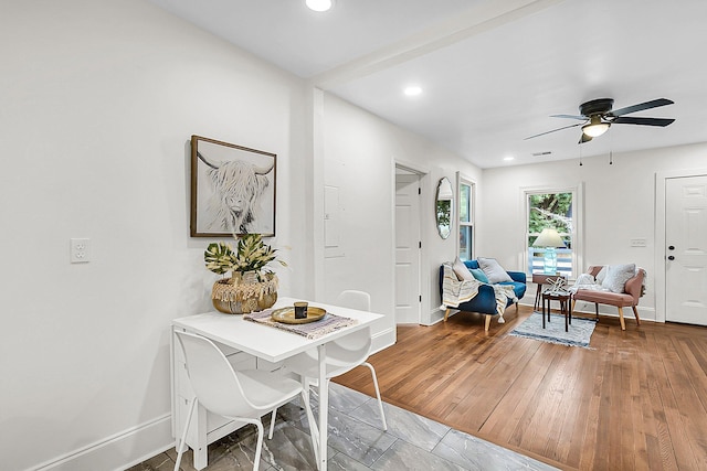 dining area with ceiling fan and wood-type flooring