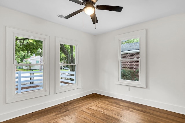 empty room with ceiling fan and wood-type flooring