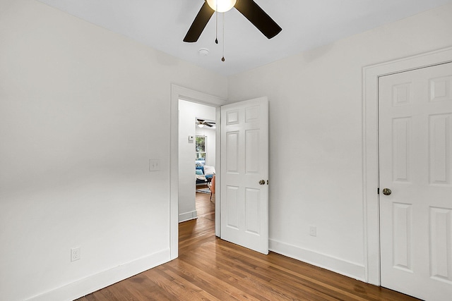 unfurnished bedroom featuring ceiling fan and hardwood / wood-style flooring