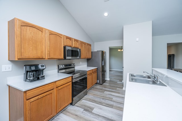 5128 Thornton Dr, Summerville, SC 29485 - kitchen featuring stainless steel appliances, a sink, lofted ceiling, light countertops, and light wood-style flooring