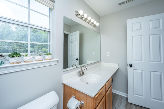 5128 Thornton Dr, Summerville, SC 29485 - bathroom with vanity, wood finished floors, toilet, and baseboards