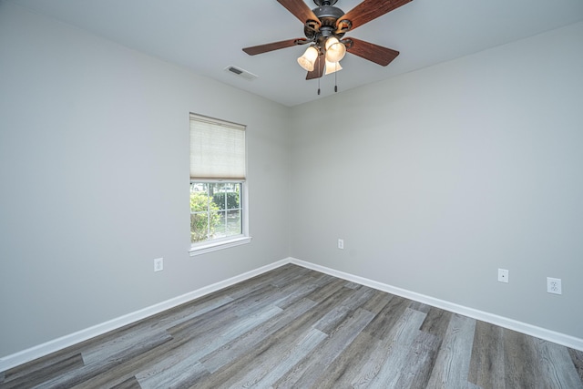 5128 Thornton Dr, Summerville, SC 29485 - spare room featuring wood finished floors, a ceiling fan, and baseboards