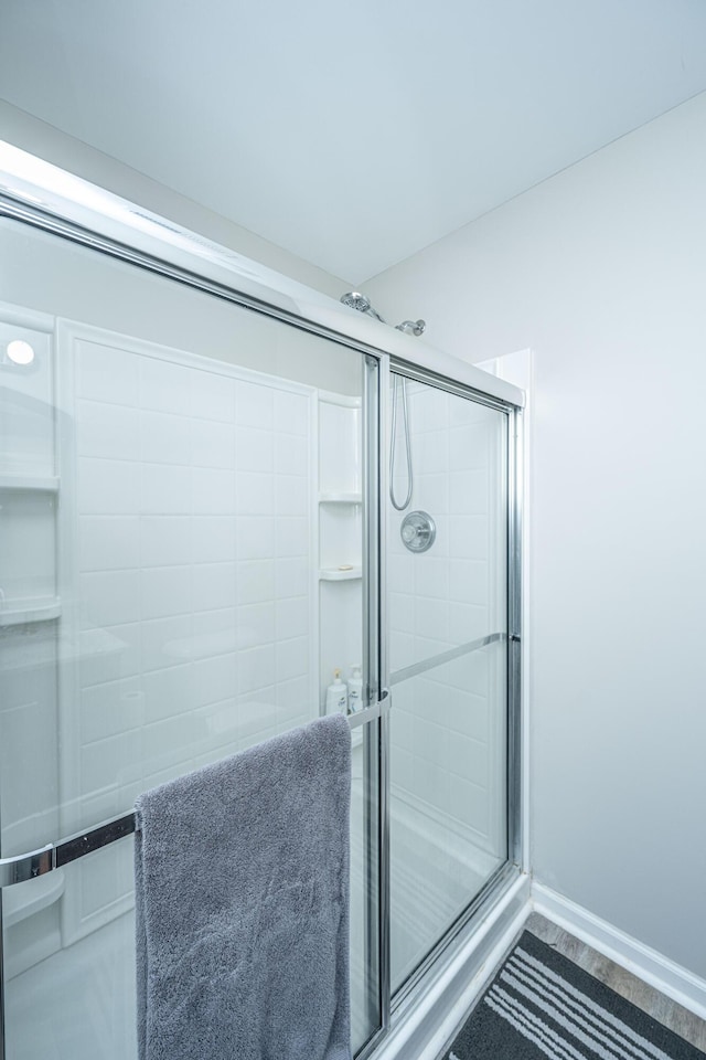 5128 Thornton Dr, Summerville, SC 29485 - full bath featuring an enclosed shower and wood finished floors