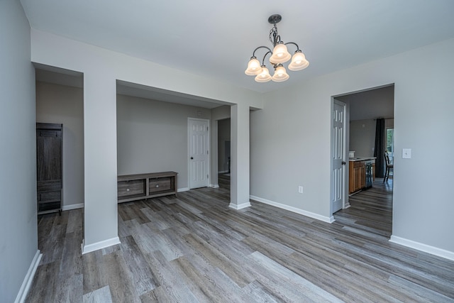 5128 Thornton Dr, Summerville, SC 29485 - unfurnished dining area with a chandelier, wood finished floors, and baseboards