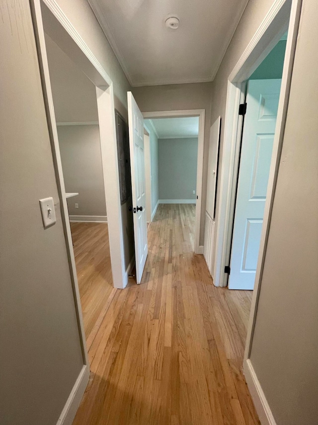 hallway with light hardwood / wood-style floors