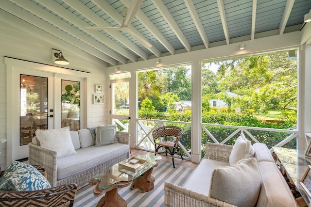 sunroom featuring lofted ceiling with beams, french doors, and wooden ceiling