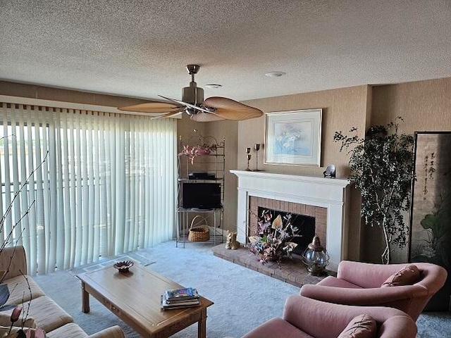 carpeted living room featuring a textured ceiling, a brick fireplace, ceiling fan, and a wealth of natural light