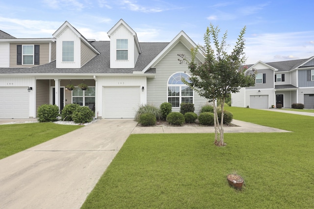 192 Buchanan Cir, Goose Creek, SC 29445 - townhome / multi-family property with roof with shingles, driveway, a front lawn, and a garage