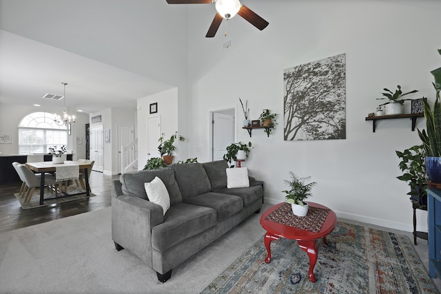 192 Buchanan Cir, Goose Creek, SC 29445 - living room featuring ceiling fan, a chandelier, wood finished floors, and a high ceiling