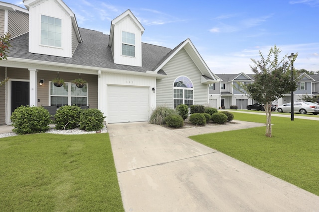 192 Buchanan Cir, Goose Creek, SC 29445 - view of front of house with a front lawn, roof with shingles, driveway, and an attached garage