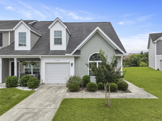 192 Buchanan Cir, Goose Creek, SC 29445 - view of front facade with roof with shingles, a front yard, driveway, and board and batten siding