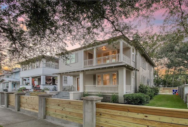 view of front of home with covered porch and a balcony