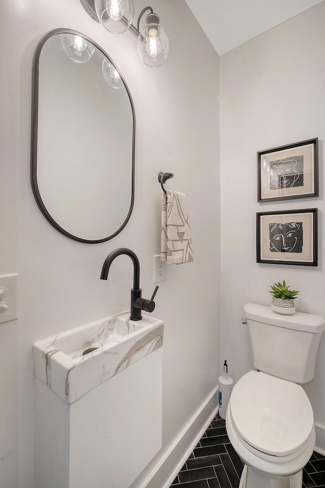 bathroom featuring tile patterned flooring and toilet