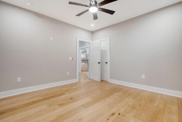 unfurnished bedroom with ceiling fan and light hardwood / wood-style floors