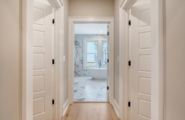 hallway featuring light wood-type flooring