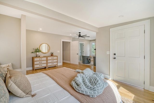 bedroom with ceiling fan and hardwood / wood-style floors