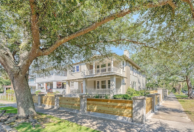 view of front of home featuring a balcony