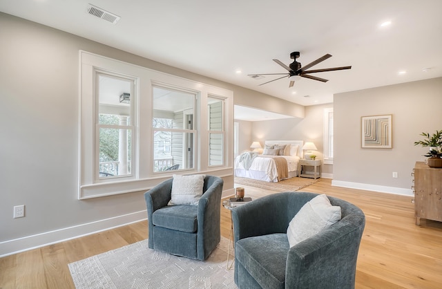 bedroom with ceiling fan and light hardwood / wood-style flooring