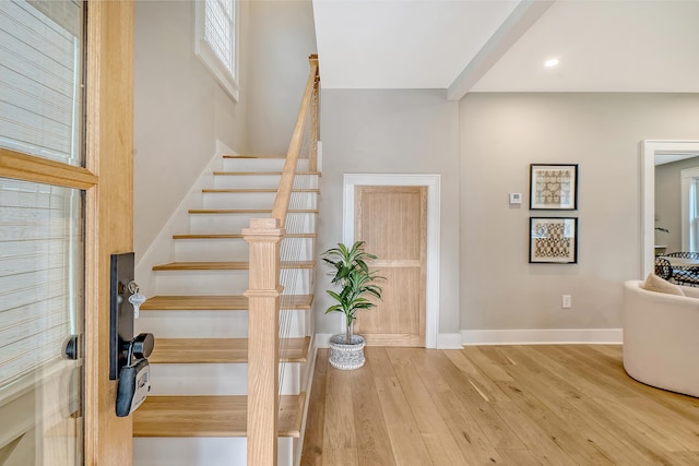 stairs featuring wood-type flooring