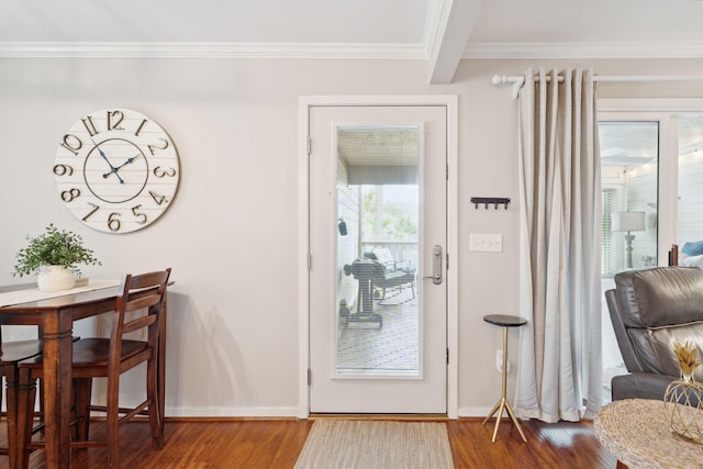 doorway to outside with ornamental molding and wood-type flooring