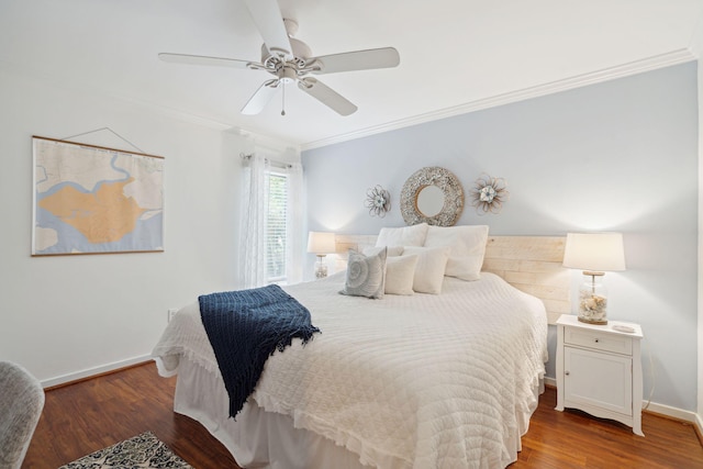 bedroom featuring ceiling fan, dark wood-type flooring, and crown molding