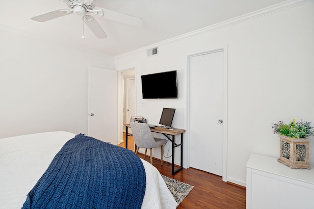 bedroom featuring ornamental molding, dark hardwood / wood-style floors, and ceiling fan