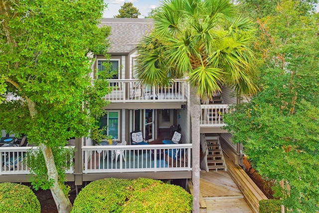 rear view of house featuring a deck