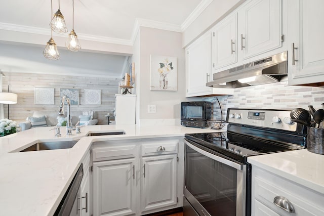 kitchen with tasteful backsplash, sink, white cabinets, hanging light fixtures, and stainless steel appliances