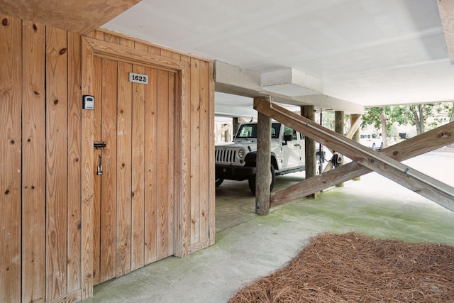 interior space featuring wooden walls