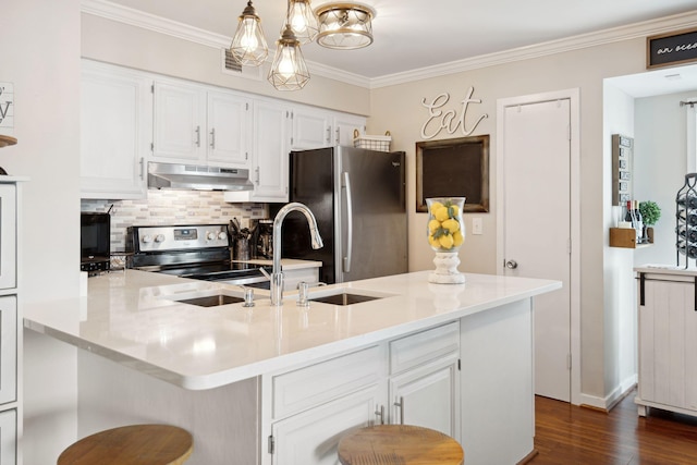 kitchen featuring hanging light fixtures, dark wood-type flooring, white cabinetry, appliances with stainless steel finishes, and a notable chandelier