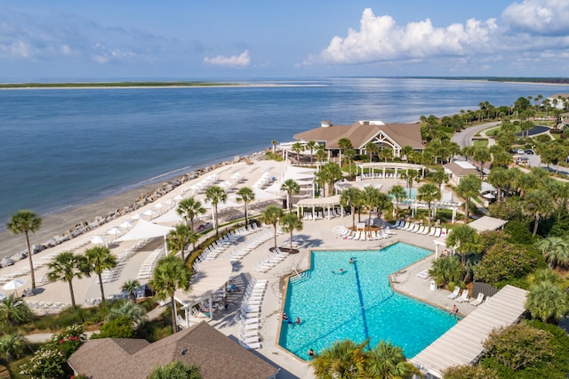 bird's eye view featuring a water view and a beach view