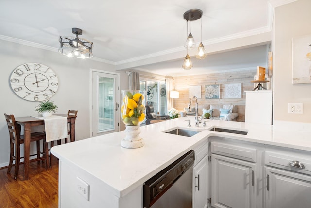 kitchen featuring dark hardwood / wood-style flooring, dishwasher, ornamental molding, and sink