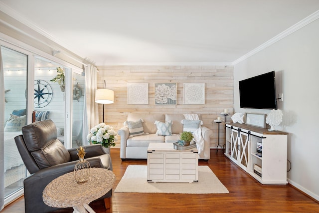 living room with wood walls, dark wood-type flooring, and crown molding