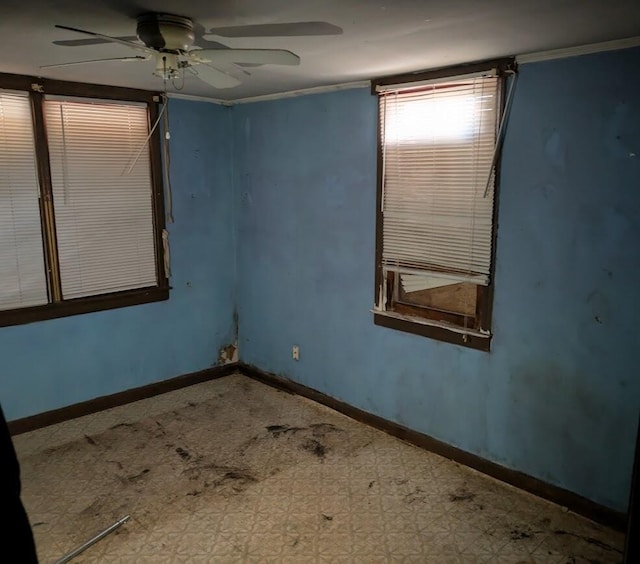 unfurnished room with ceiling fan