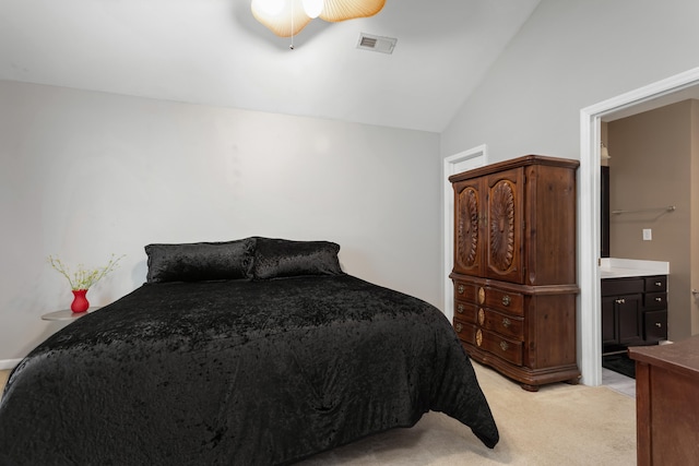 bedroom with ceiling fan, light colored carpet, connected bathroom, and high vaulted ceiling