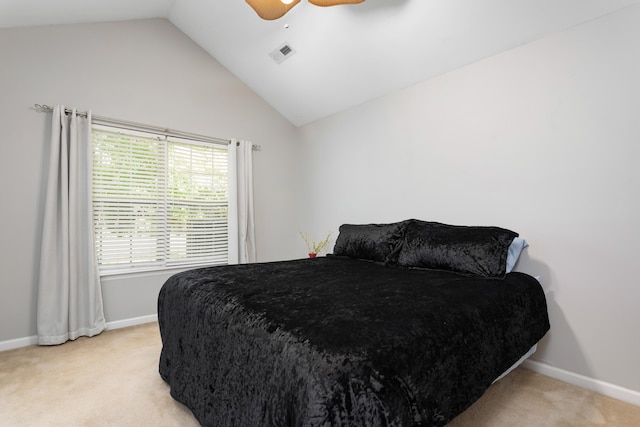 carpeted bedroom featuring ceiling fan and vaulted ceiling