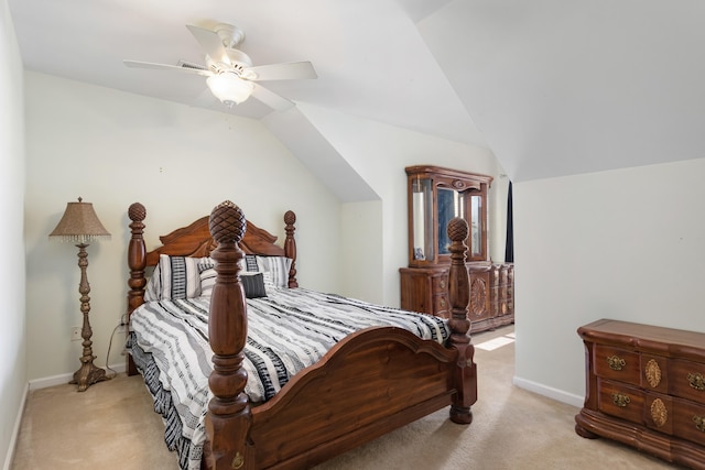 carpeted bedroom featuring ceiling fan and vaulted ceiling