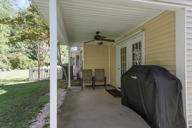 view of patio with area for grilling and ceiling fan