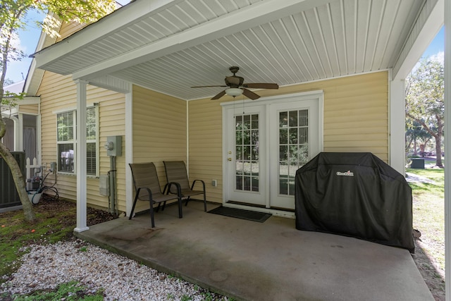 view of patio with ceiling fan, area for grilling, and french doors