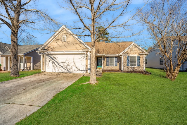 view of front of property with a garage and a front yard