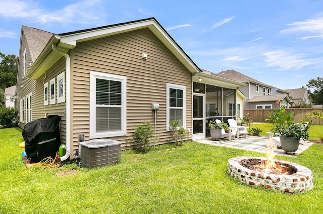 3789 Tupelo Branch Row, Mount Pleasant, SC 29429 - rear view of property featuring a fire pit, a patio, and a sunroom