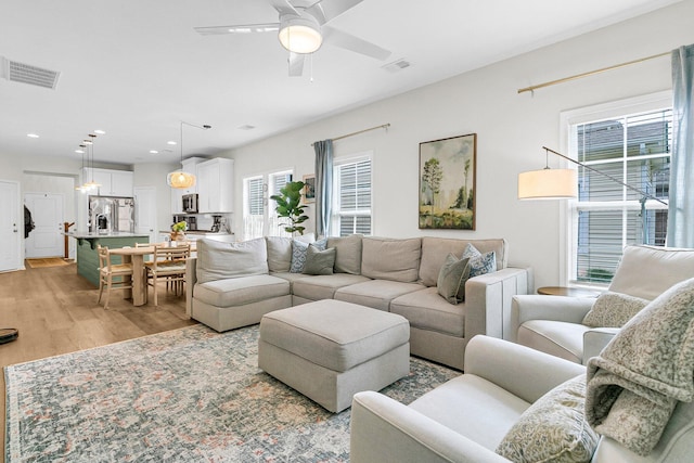 3789 Tupelo Branch Row, Mount Pleasant, SC 29429 - living area with plenty of natural light, light wood finished floors, a ceiling fan, and recessed lighting