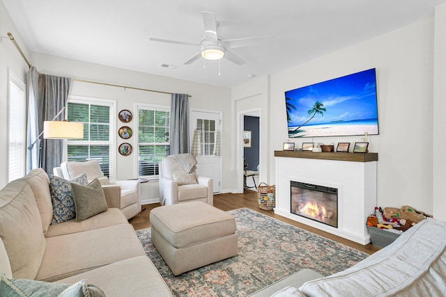3789 Tupelo Branch Row, Mount Pleasant, SC 29429 - living room with a glass covered fireplace, ceiling fan, and wood finished floors