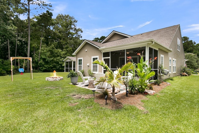 3789 Tupelo Branch Row, Mount Pleasant, SC 29429 - back of house with a fire pit, a shingled roof, and a sunroom