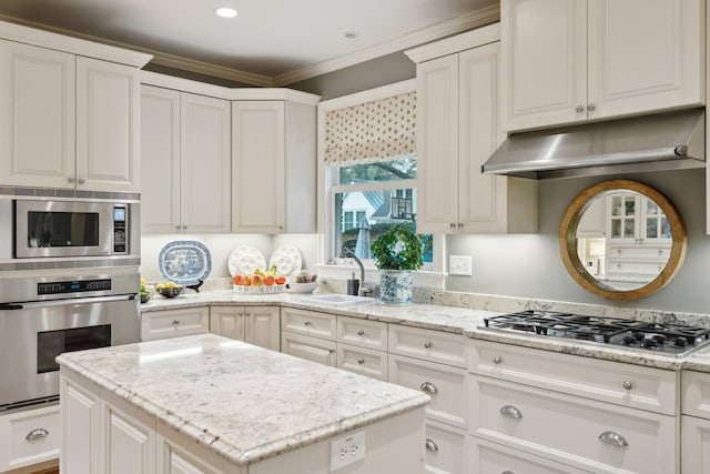 kitchen featuring appliances with stainless steel finishes and white cabinetry