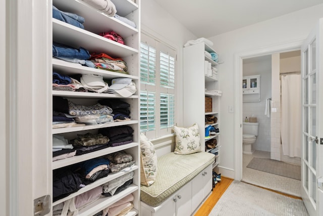 spacious closet featuring light hardwood / wood-style flooring