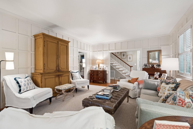 living room featuring hardwood / wood-style flooring and crown molding